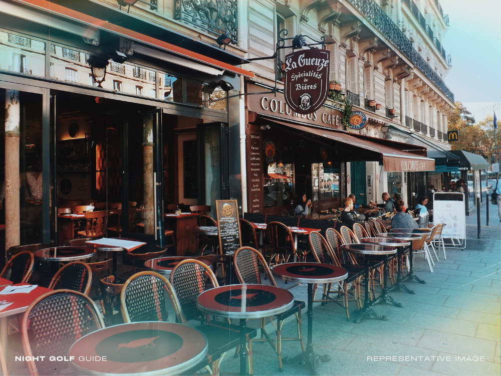 French street café scene with outdoor seating before night golf