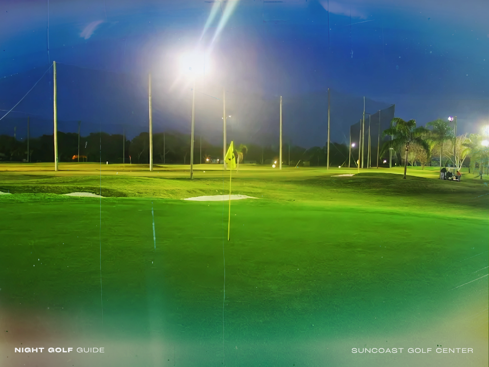 Nighttime view of Suncoast Golf Center 1 featuring illuminated fairways, golfers in action, and glowing clubhouse